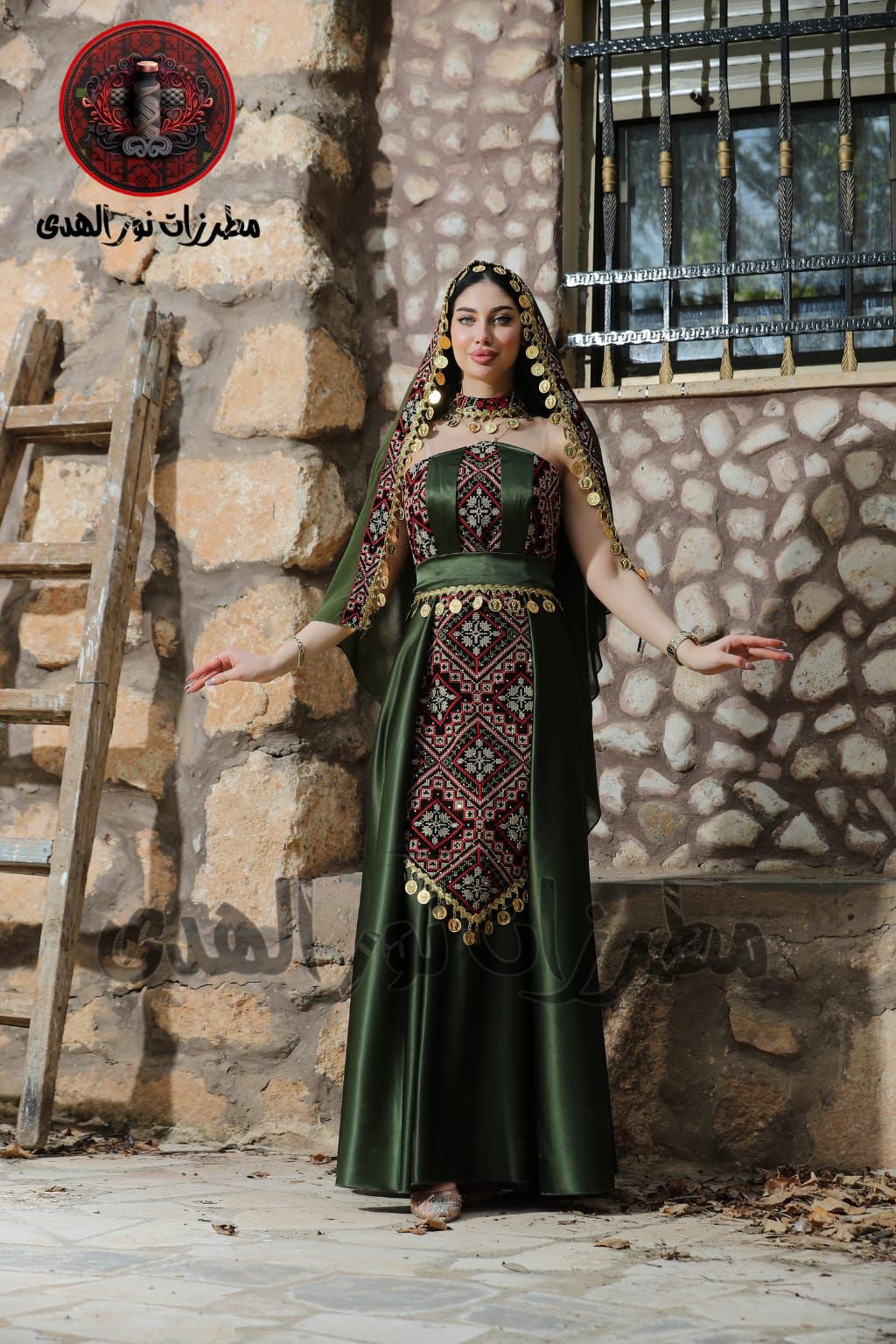 Olive green henna dress with Palestinian Tatreez-inspired front embroidery, matching belt, and traditional coin details