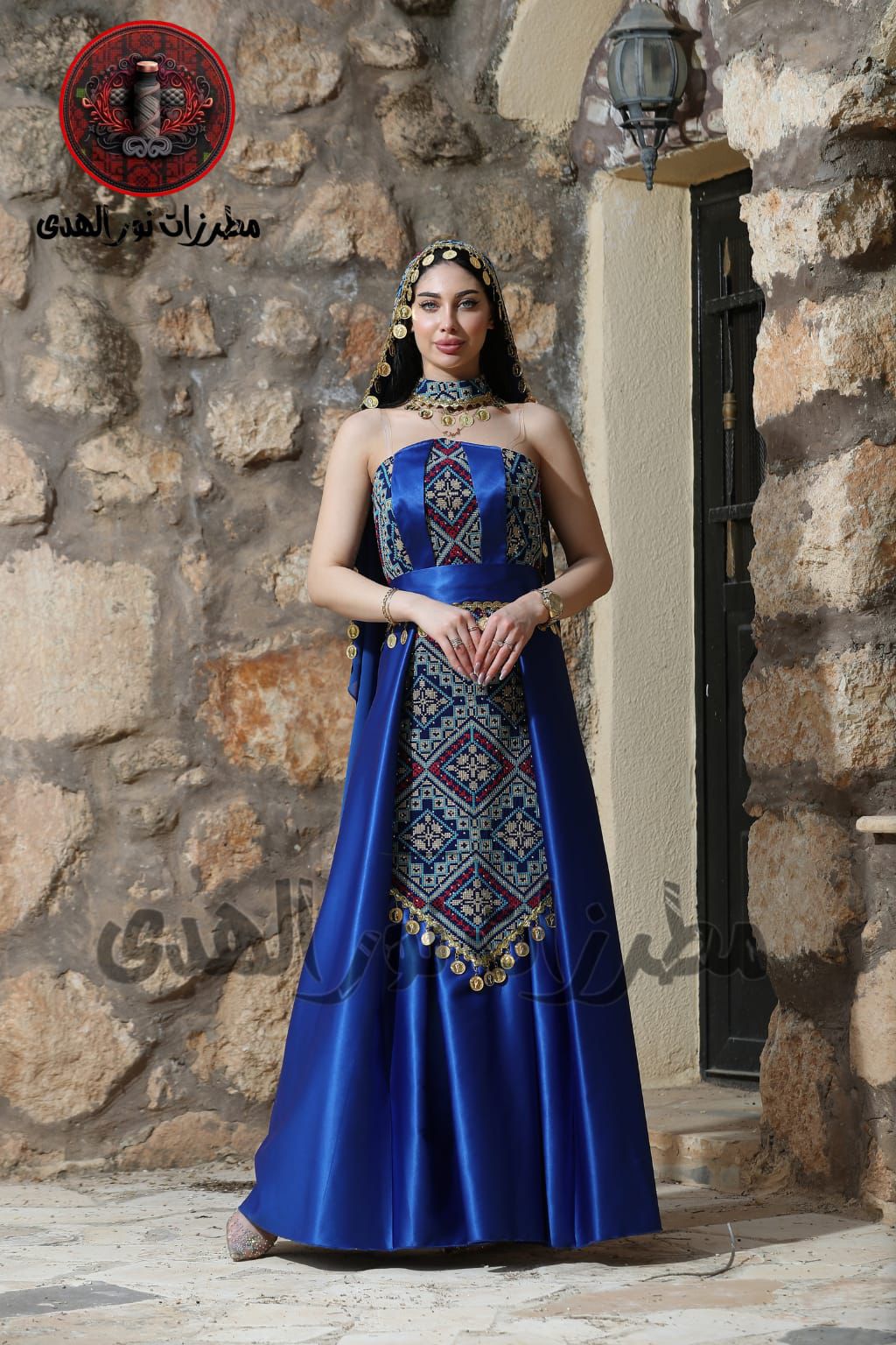 Indigo blue Palestinian embroidered henna dress with traditional coin details, matching belt, and decorated front panel