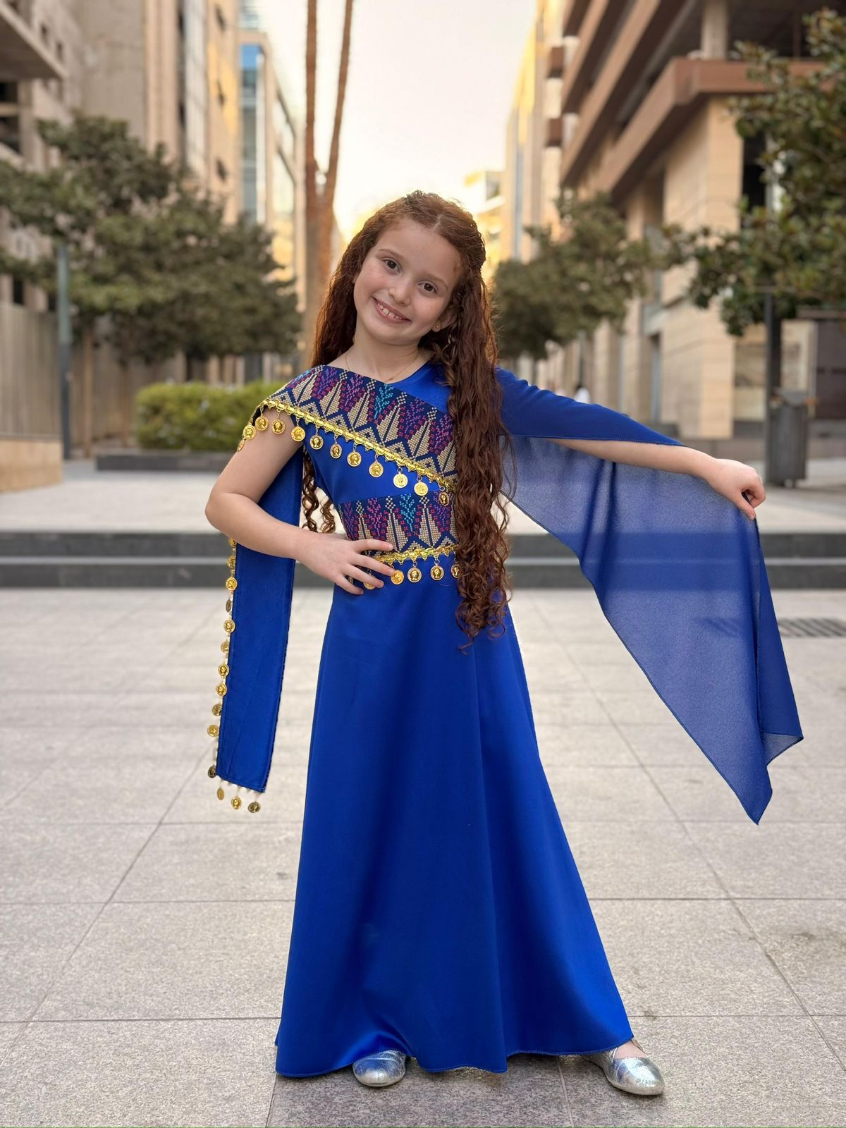 Indigo blue girls Palestinian embroidered shoulder dress with gold coin details and flowing side drape