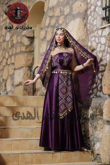 Berry purple Jawharat Al-Henna Dress with Palestinian Tatreez-inspired embroidery, draped head cover, and gold coin details