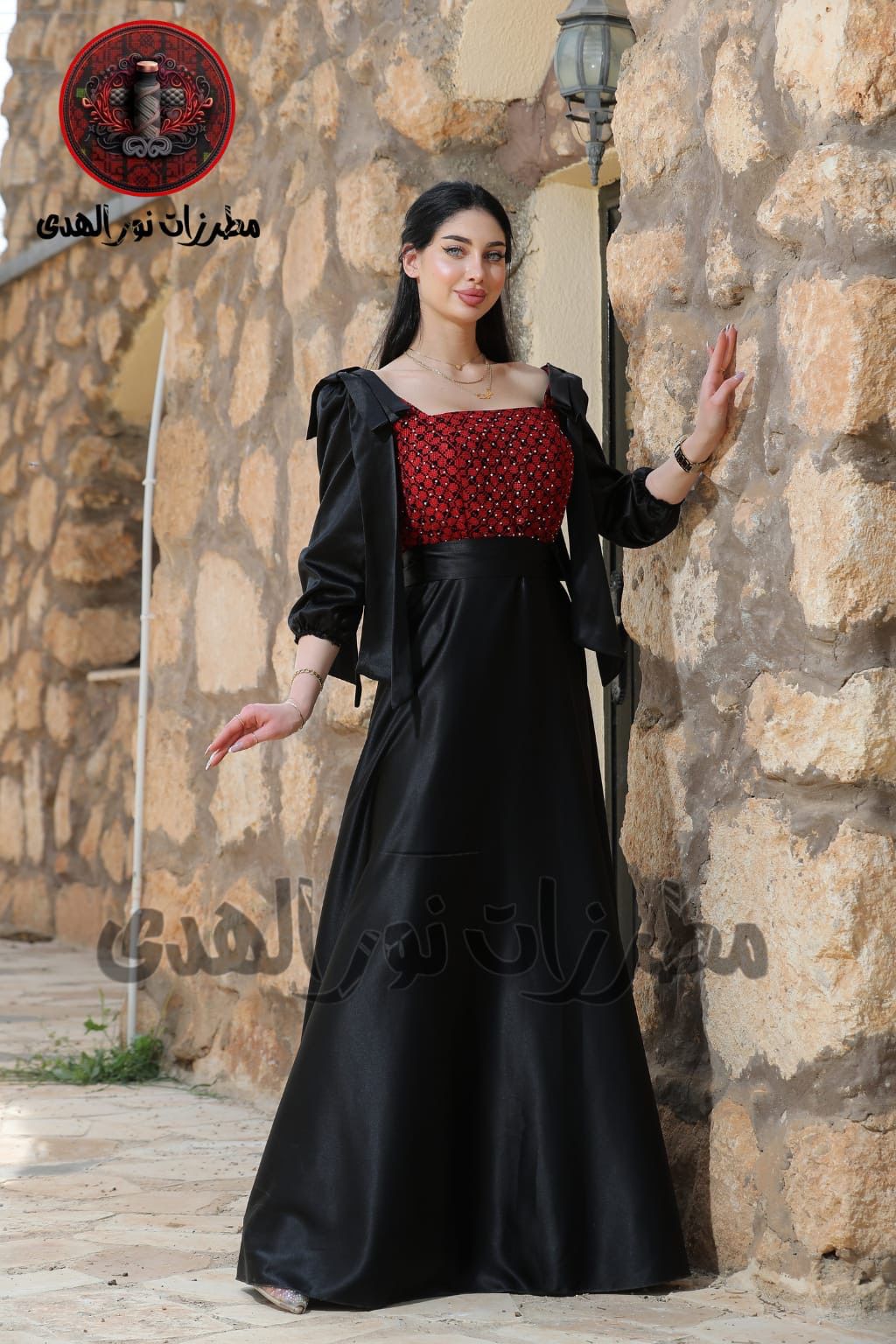 Black long satin Palestinian embroidered dress with red Tatreez-inspired bodice and waist sash for henna occasions