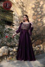 Burgundy long satin Palestinian embroidered heritage dress with fitted Tatreez-inspired bodice and flowing silhouette