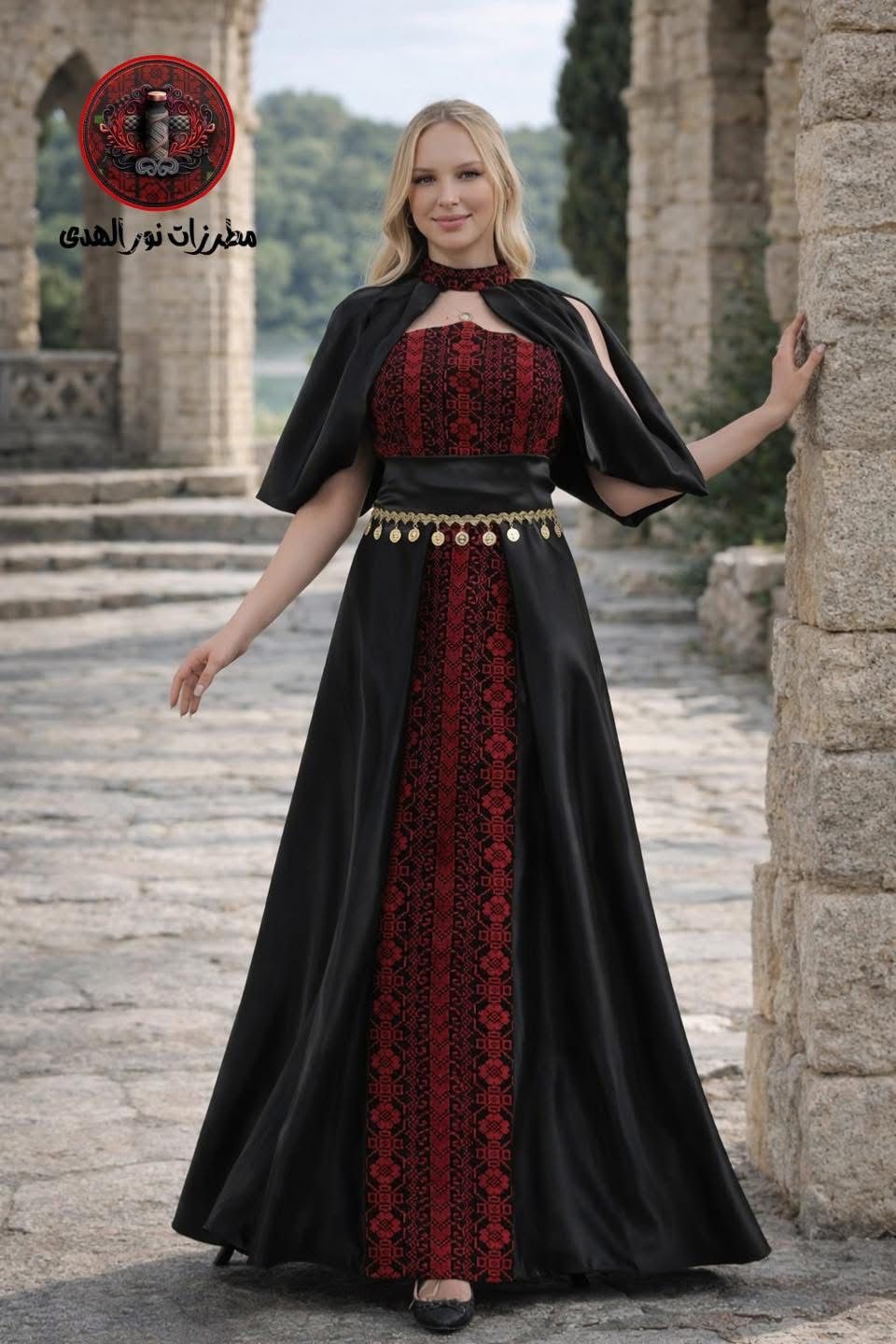 Black Ameera Al-Henna Dress with red embroidery, cape sleeves, and gold coin-inspired waist detail
