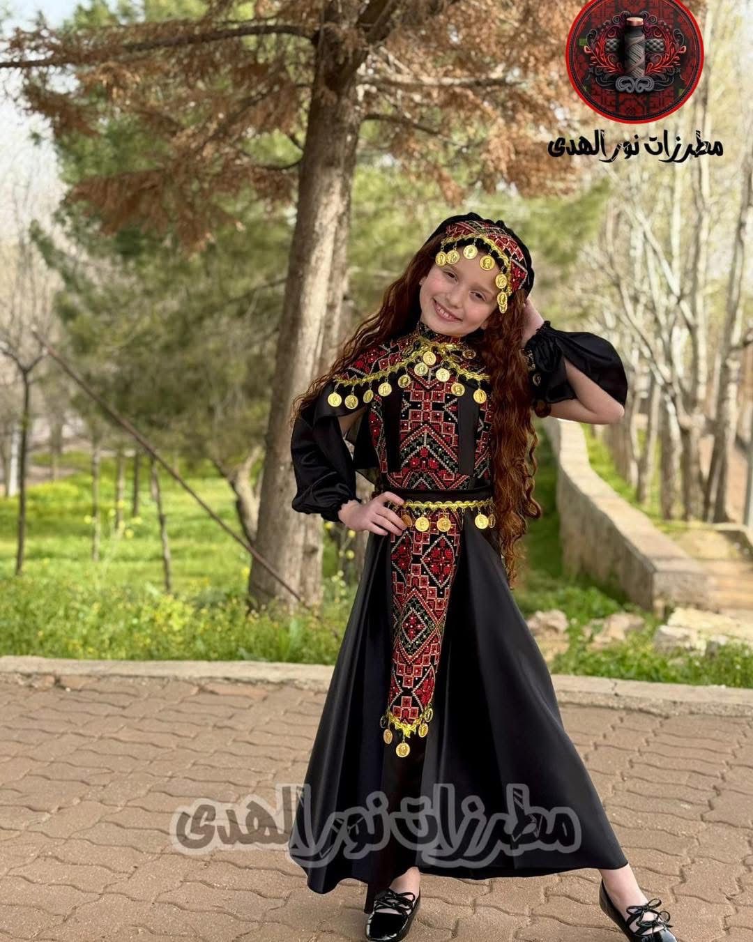 Girls Palestinian embroidered henna dress in black luxury satin with red Tatreez-inspired details and gold coin accents