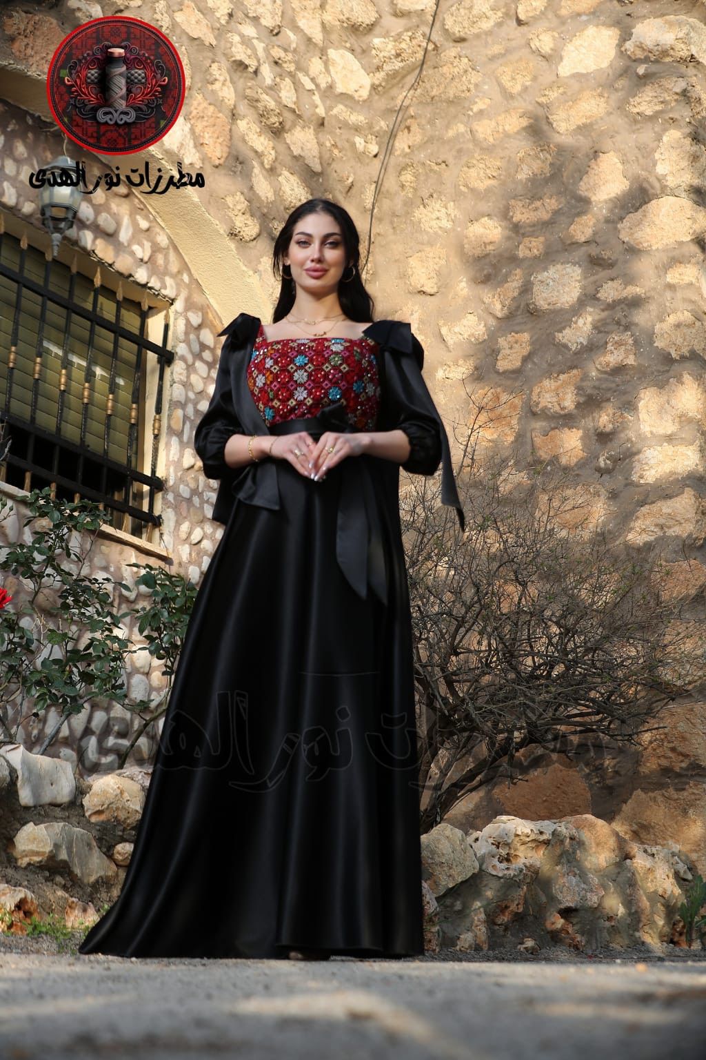 Black long satin Palestinian embroidered dress with mixed Tatreez-inspired bodice and waist bow for special occasions