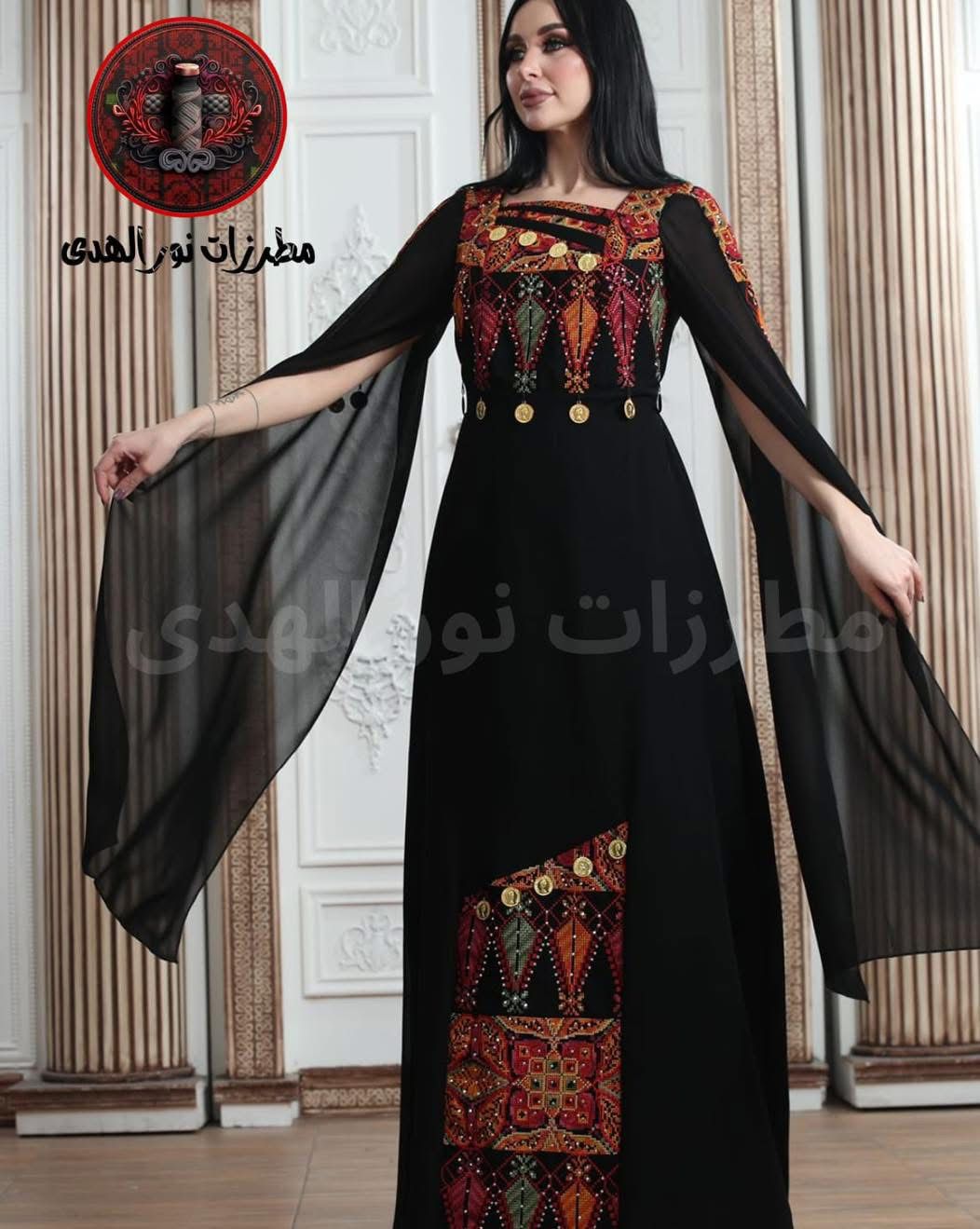 White chiffon lined Palestinian embroidered thobe with square neckline, gold coin details, and flowing cape-style sleeves, ثوب فلسطيني أبيض من الشيفون المبطن مع فتحة رقبة مربعة وتطريز ملون وتفاصيل عملات ذهبية وأكمام كاب منسدلة