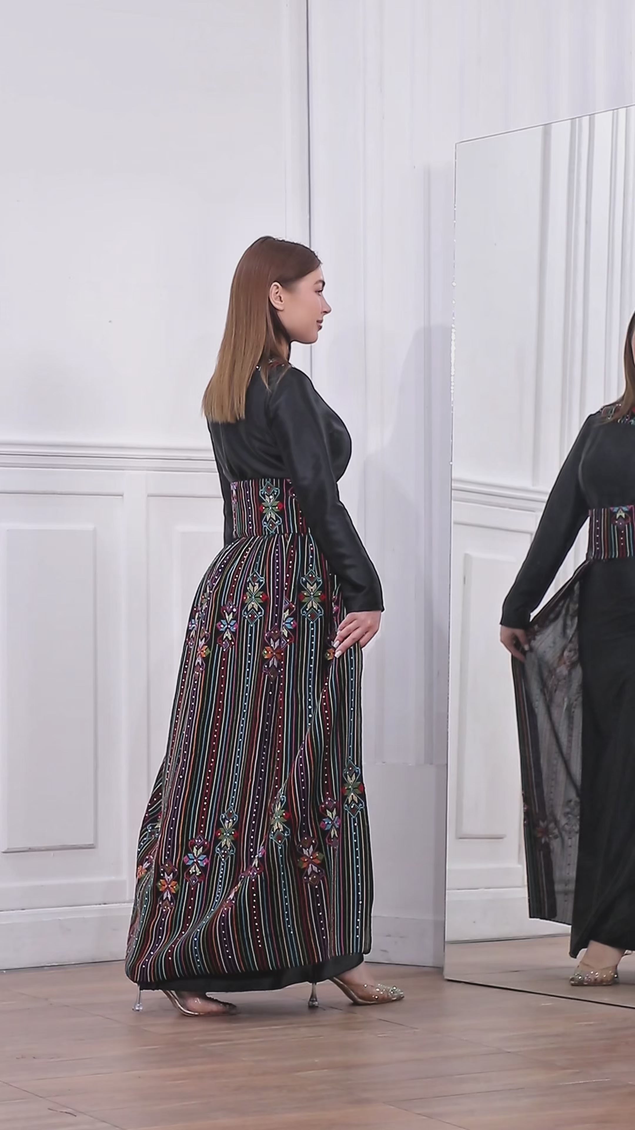 Load video: Black Satin Oriental Embroidered Thobe with Colorful Tatreez Details | Al-Ameera Thobe