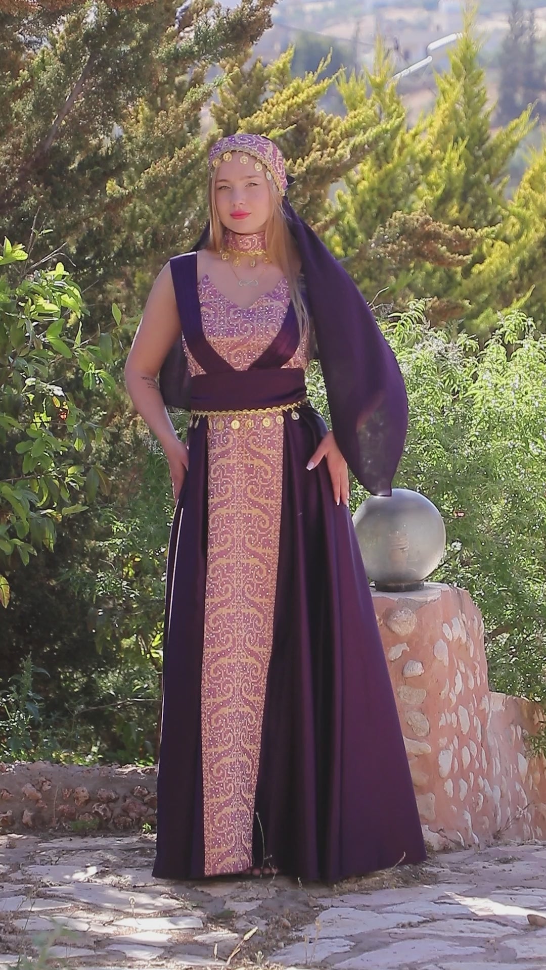 Load video: Satin Oriental Embroidered Thobe with Draped Veil Styling and Gold Coin Accents | Al Sundus Thobe