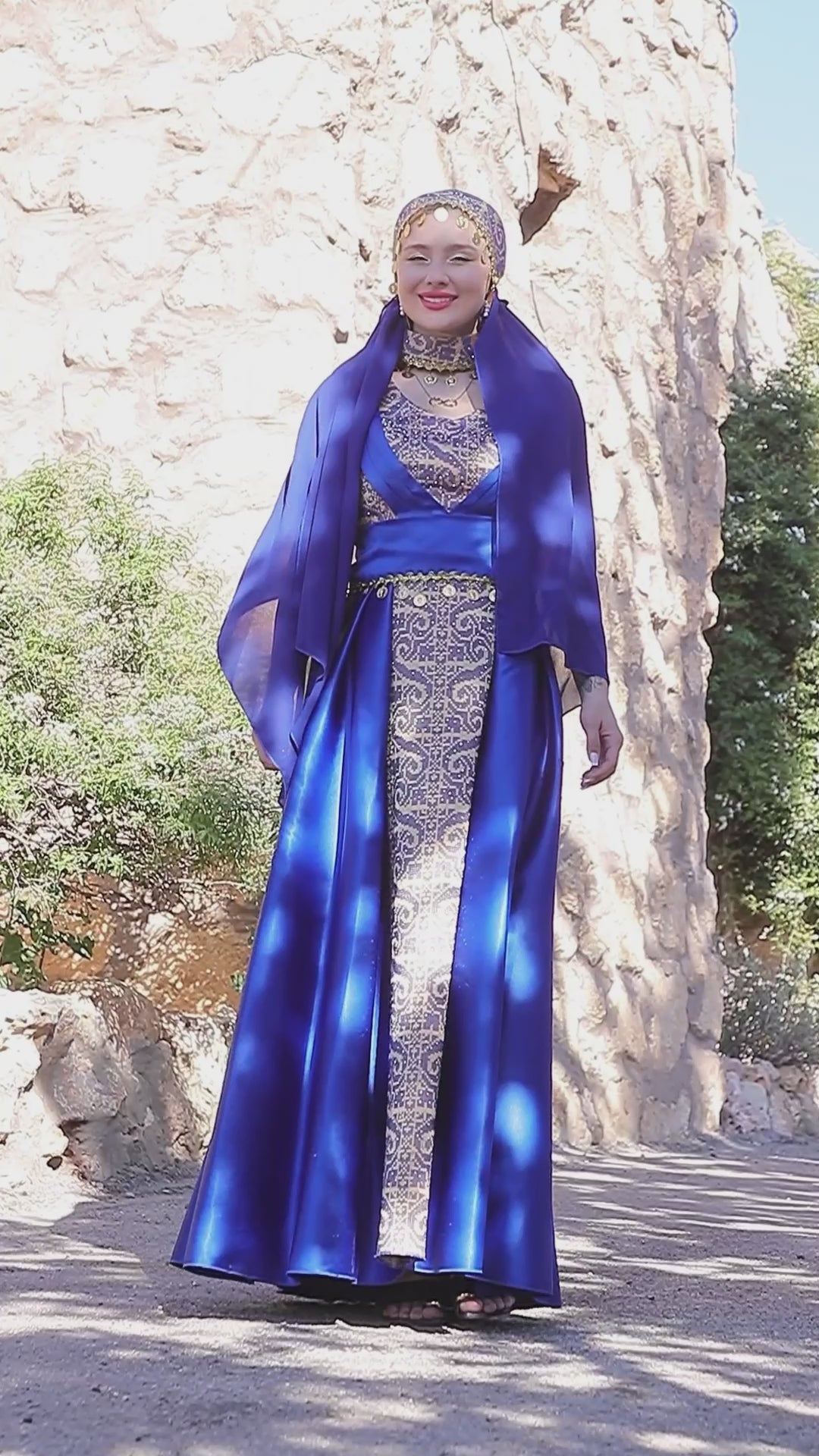 Load video: Satin Oriental Embroidered Thobe with Draped Veil Styling and Gold Coin Accents | Al Sundus Thobe